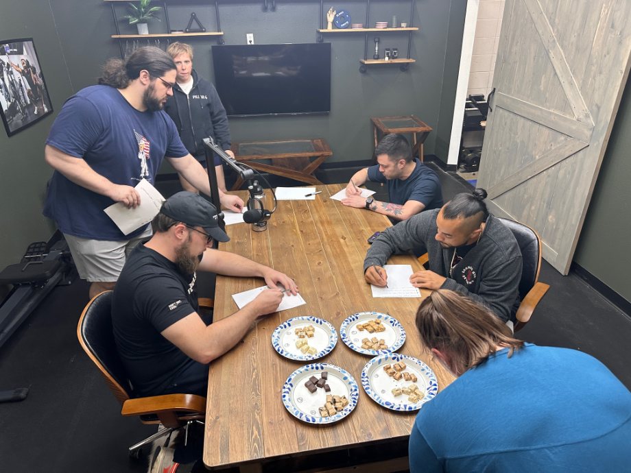 Everyone takes down notes while flavor-testing the Quest Bars.