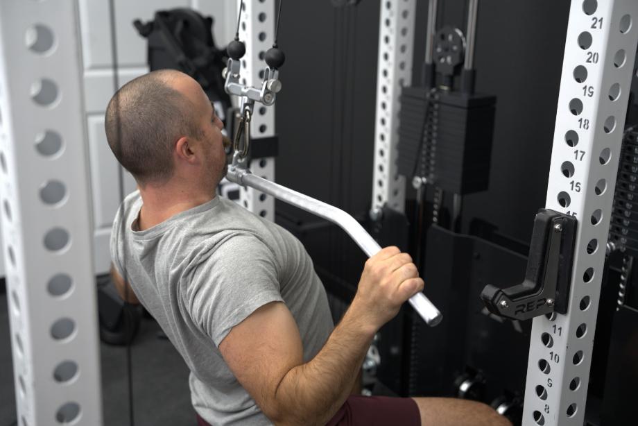 Man performing lat pulldowns on the REP Ares 2.0