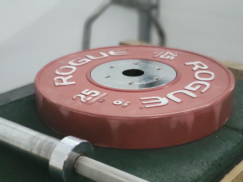 A 25-kg plate from a set of Rogue Competition Bumpers.