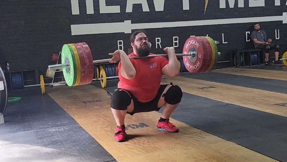 Olympian Caine Wilkes works out with a clean set of Rogue Competition Bumpers.