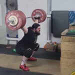 Olympian Caine Wilkes performs a perfectly-balanced snatch using Rogue Competition Bumpers.