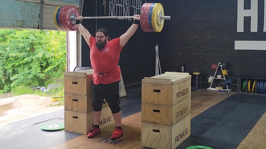 Olympian Caine Wilkes performs a split jerk with Rogue Competition Bumpers.