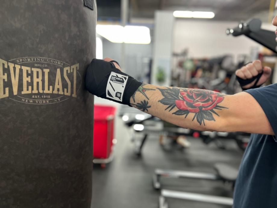 A close look at a Sanabul Hand Wrap while punching a punching bag