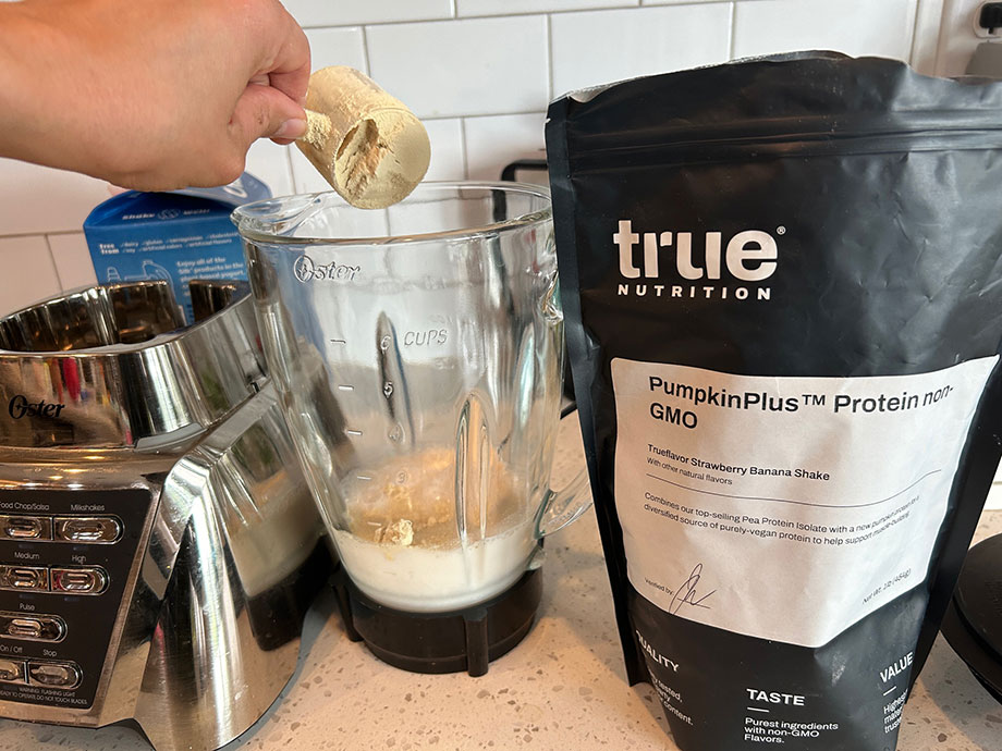 scoop-of-true-nutrition-pumpkin-powder-added-to-blender