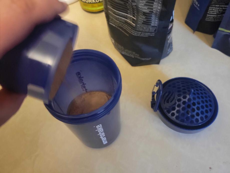 Pouring the protein into the SmartShake