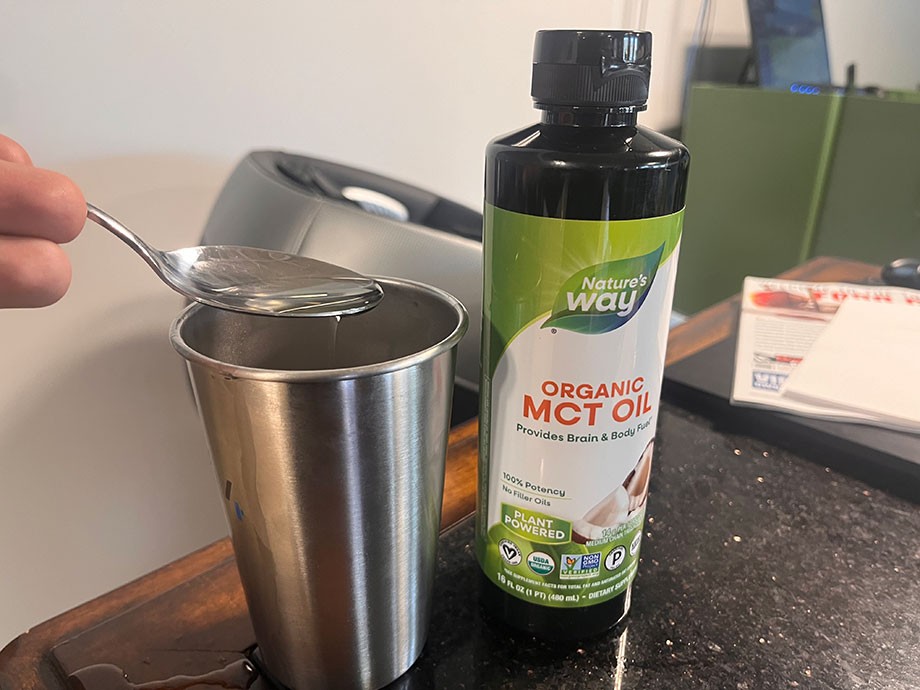 A spoonful of Nature's Way MCT Oil next to the bottle