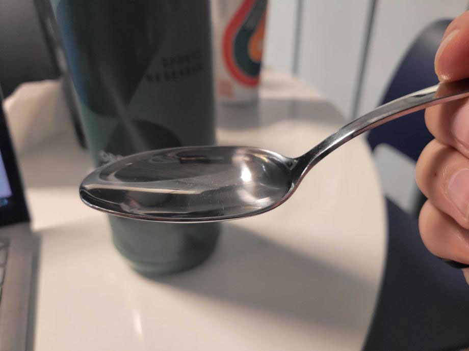 A close look at Sports Research MCT Oil in a spoon.