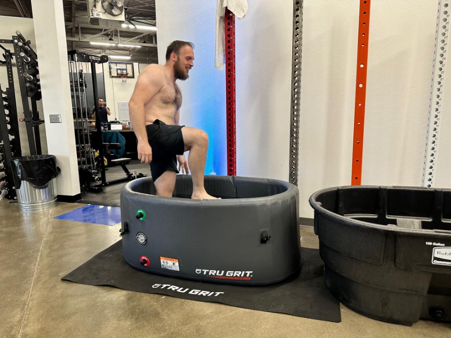 Our tester steps into the Tru Grit Cold Tub.