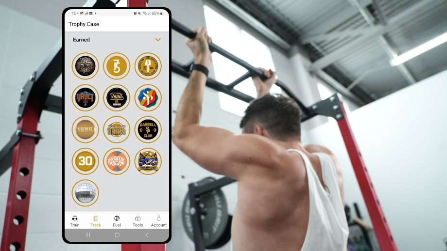 A man is doing pull-ups next to a screenshot from the Street Parking app.