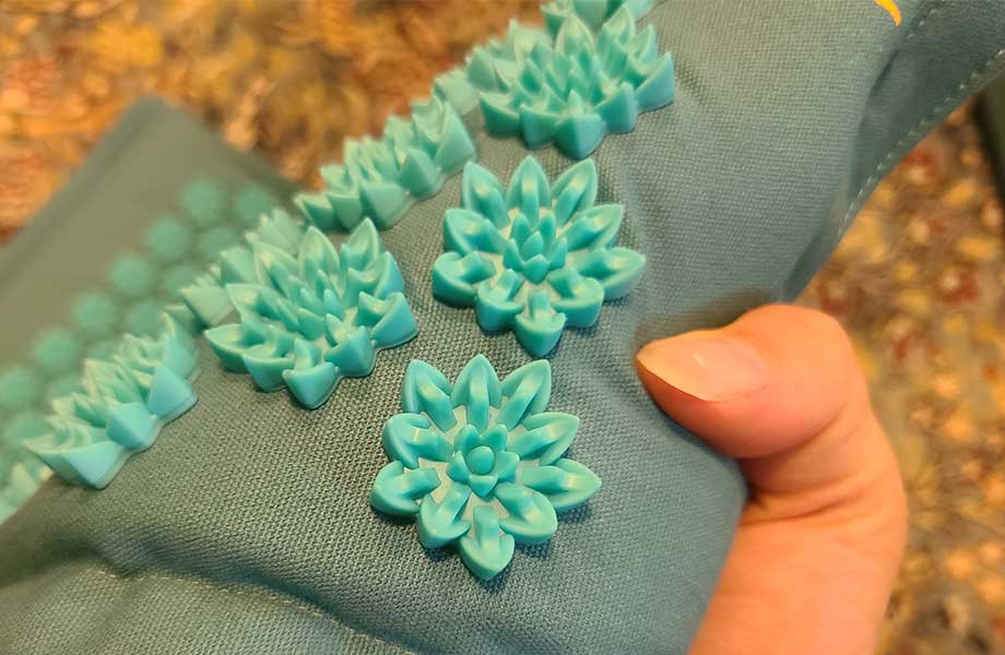 A close look at the spikes on a TimeBeeWell Acupressure Mat.