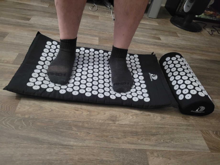 Man standing on the DoSensePro Acupressure Mat