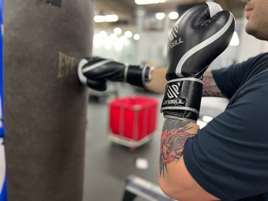 Man using the Sanabul Essential Gel Boxing Gloves