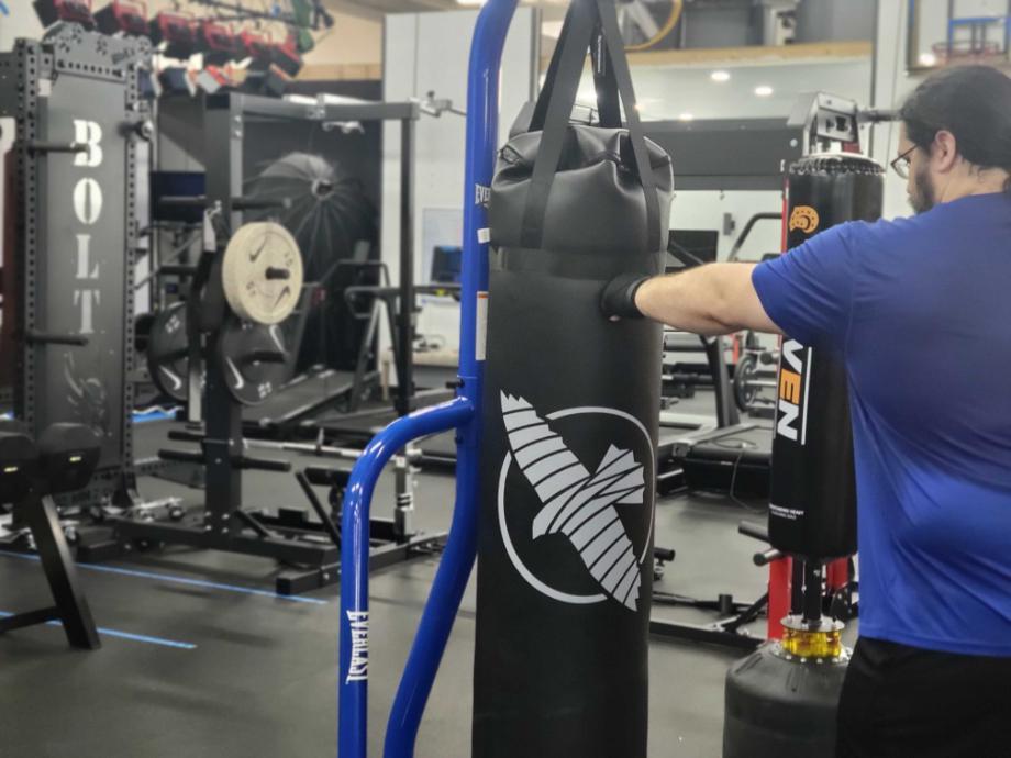 Olympian Caine Wilkes lays into a punching bag with Venum Gel Pro Wraps