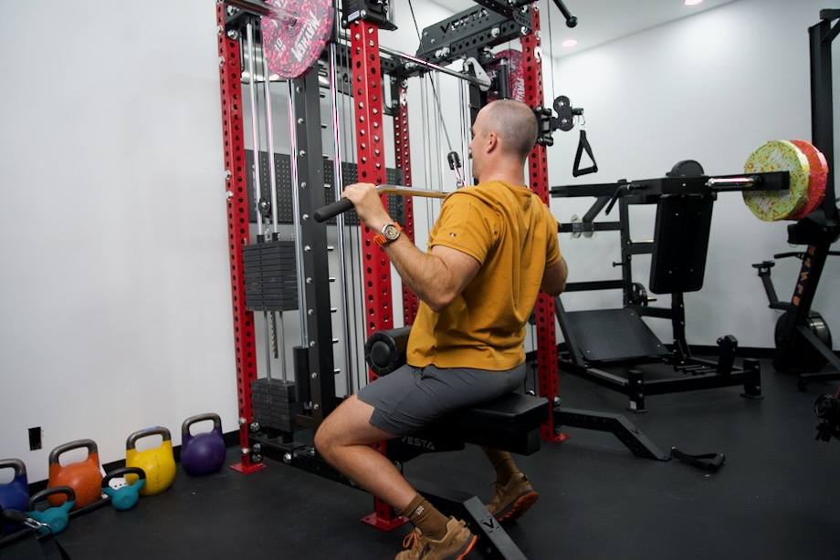 Coop does a lat pulldown on the Vesta Pro