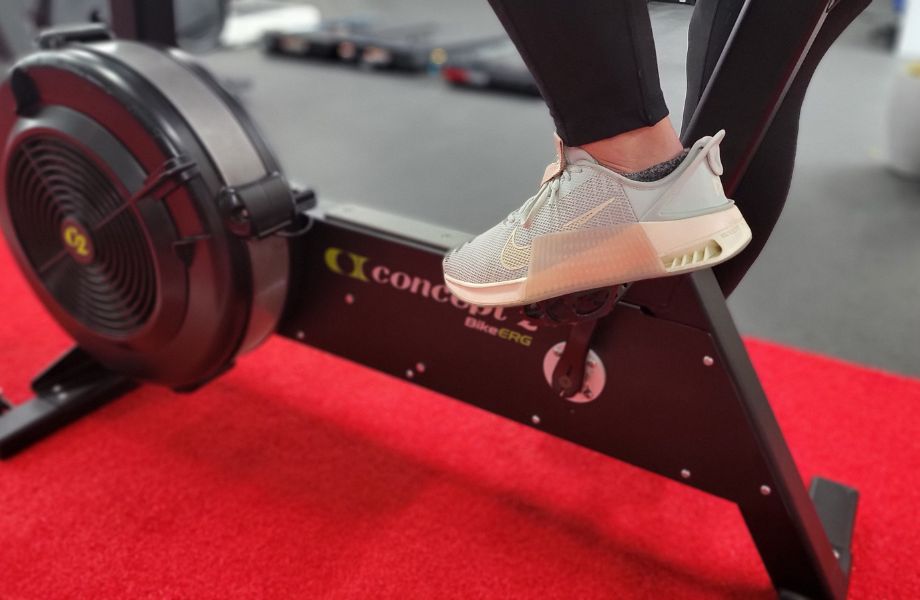 Close-up view of someone's foot on the pedal of a Concept2 BikeErg