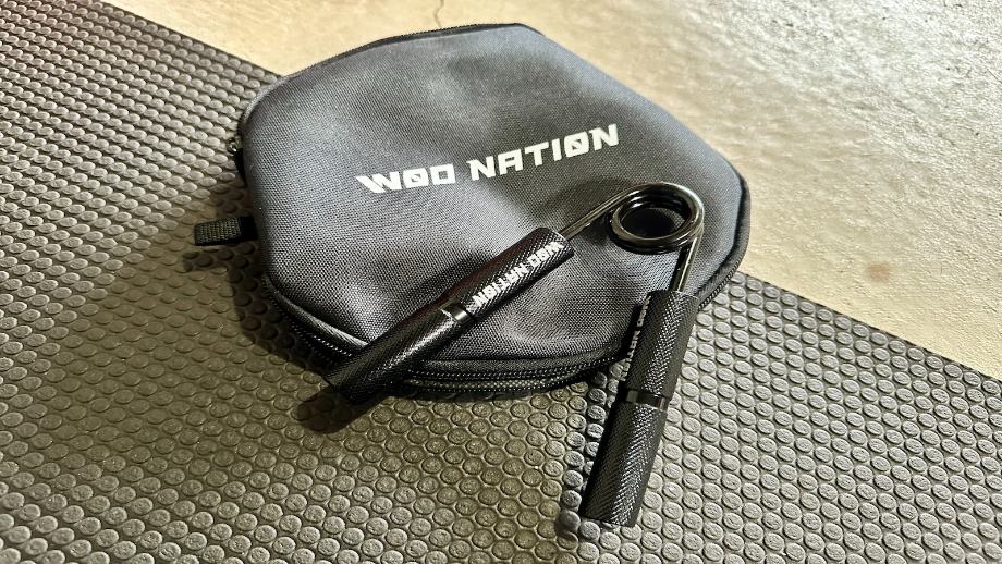 A WOD Nation Hand Grip Strengthener with the carrying case.