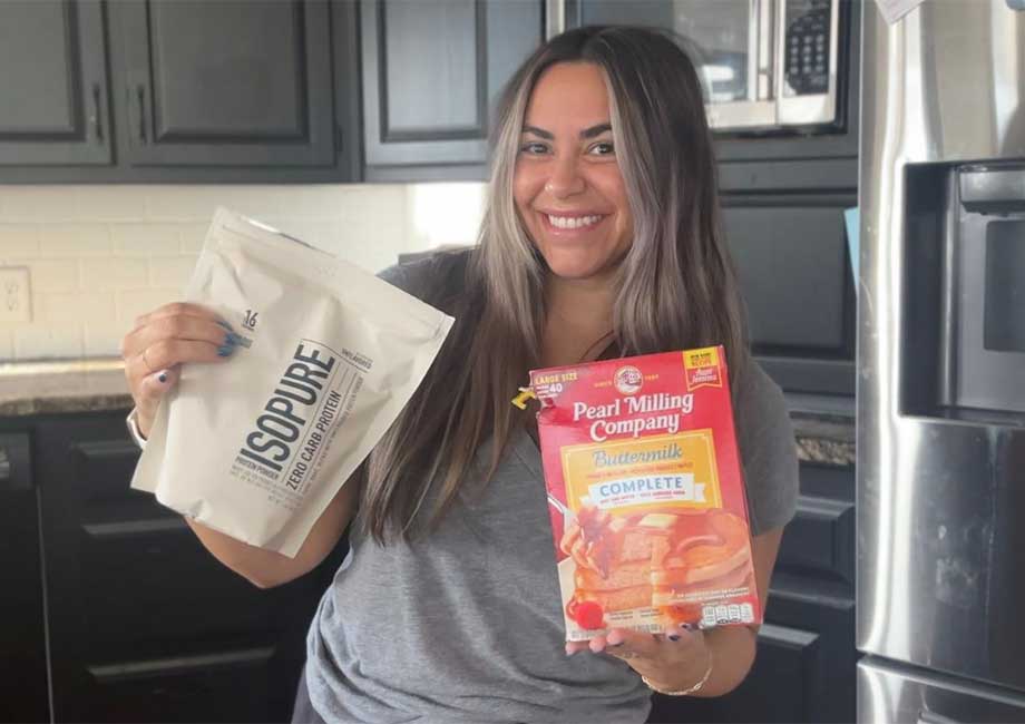 Woman holding Isopure Whey Isolate and pancake mix