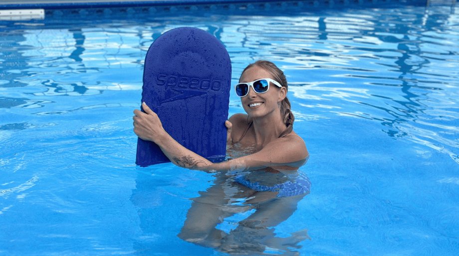 Lindsay Scheele, CPT holds up a Speedo Kickboard