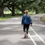 A woman wearing a sauna suit jacket.